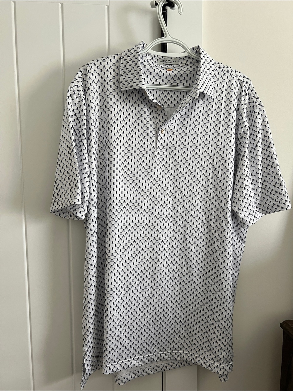 Peter Millar White Polo with Navy scull micro pattern. Never worn.